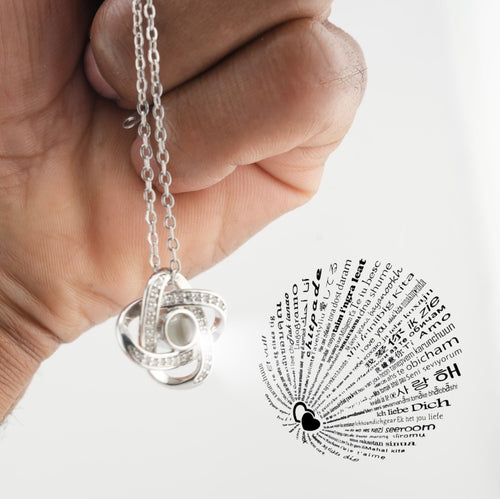 Silver Amore Box Necklace with I Love You in 100 Languages - Hand holding projection necklace
